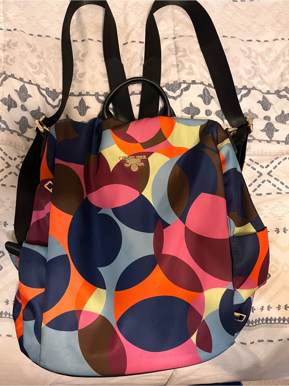 Confuse Multicolor Circle-Print Backpack in Navy, Pink, Orange & Brown